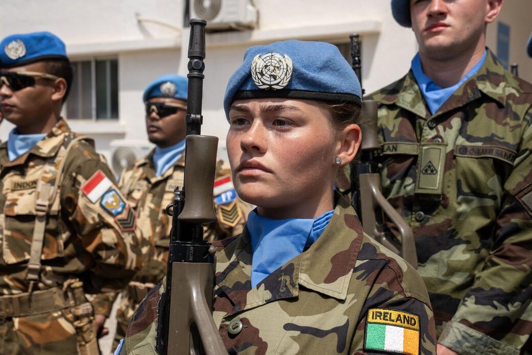 A peacekeeper is photographed in a crowd.