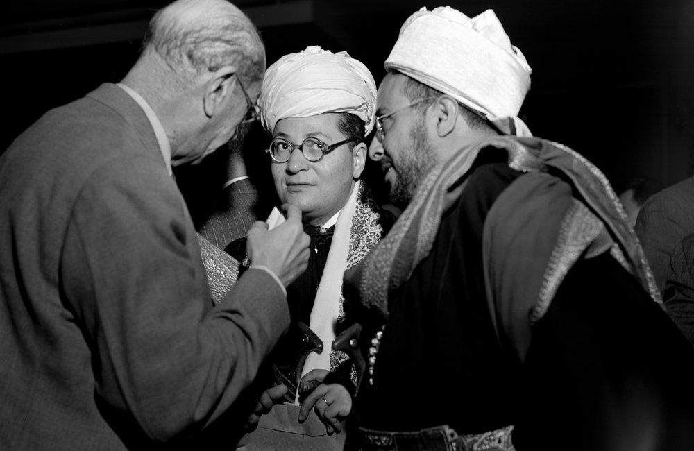 Abdol Hosayn Aziz (left) of Afghanistan, talks to Hassan Baghdadi, centre, Yemen adviser, and Prince Seif el Islam Abdullah, Yemen chairman, after the 92nd plenary meeting of Second Session of United Nations General Assembly at which Yemen was formally admitted to membership in the United Nations. 1947. UN Photo/UN Photo Library.