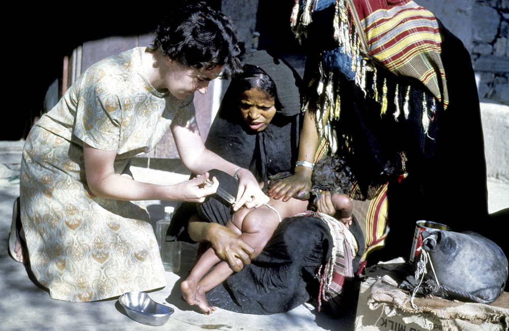 A child being vaccinated in Yemen. Preventive action against many diseases - diphtheria, measles, mumps, typhoid, whooping cough - must start early in life. 1980. UN Photo/UN Photo Library.